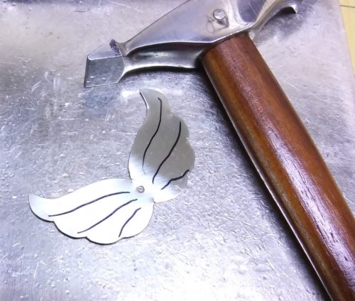 Judy Larson's Angel Ornament  - , Holiday Designs, Cutting, Cutting Tool, Cutters, Forging, Forging Jewelry, Jewelry Forging, How To Punch Holes, Hole Punching, Punch A Hole, Stamping, Stamps, Texturing,  After texturing feather lines on Wings B